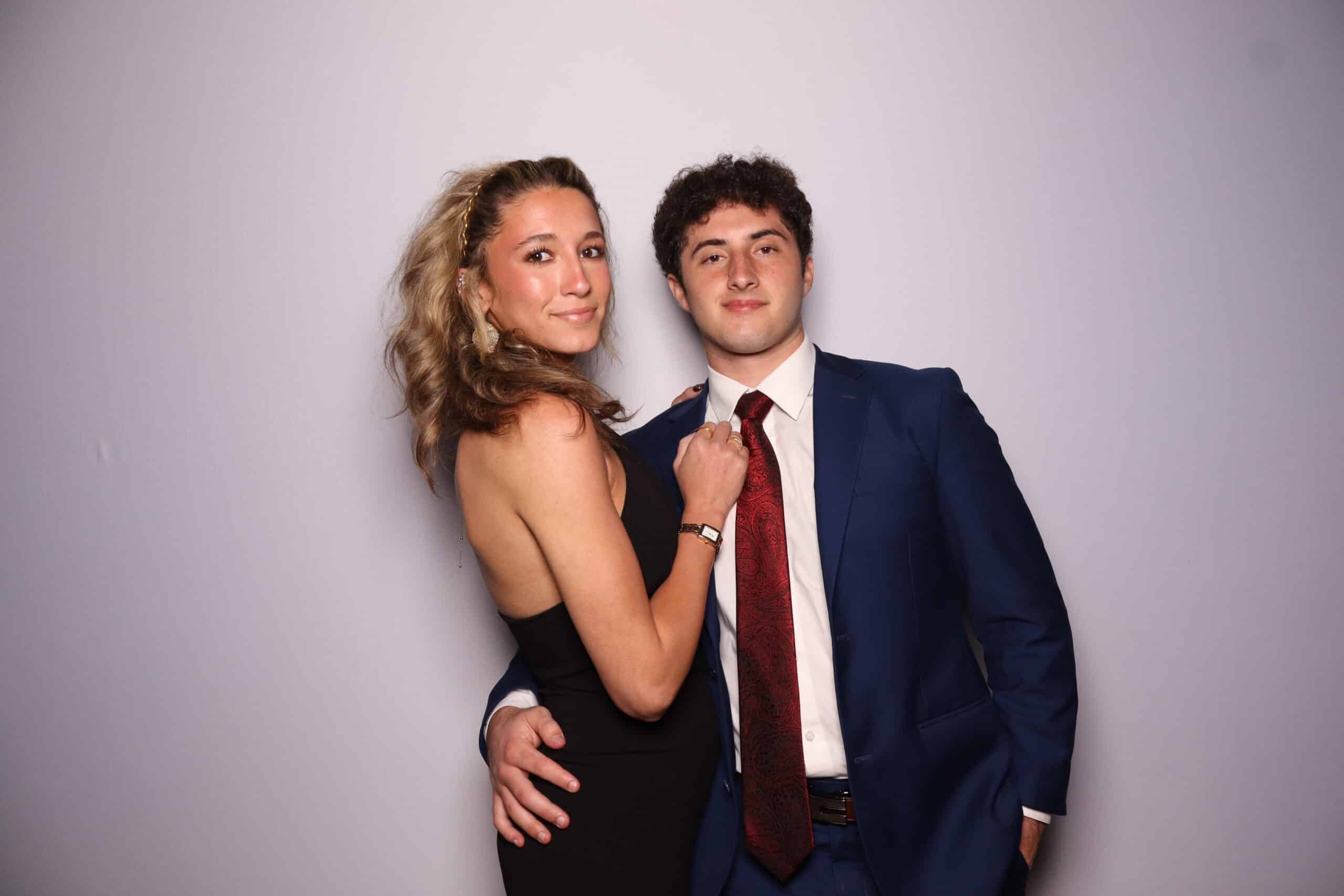 Couple posing at a wedding for a photo.