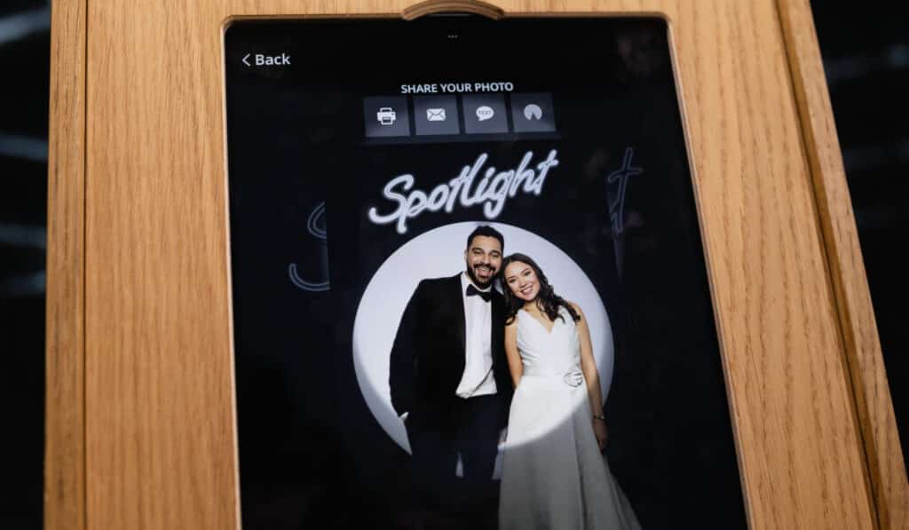 Wedding couple taking photo with photo booth