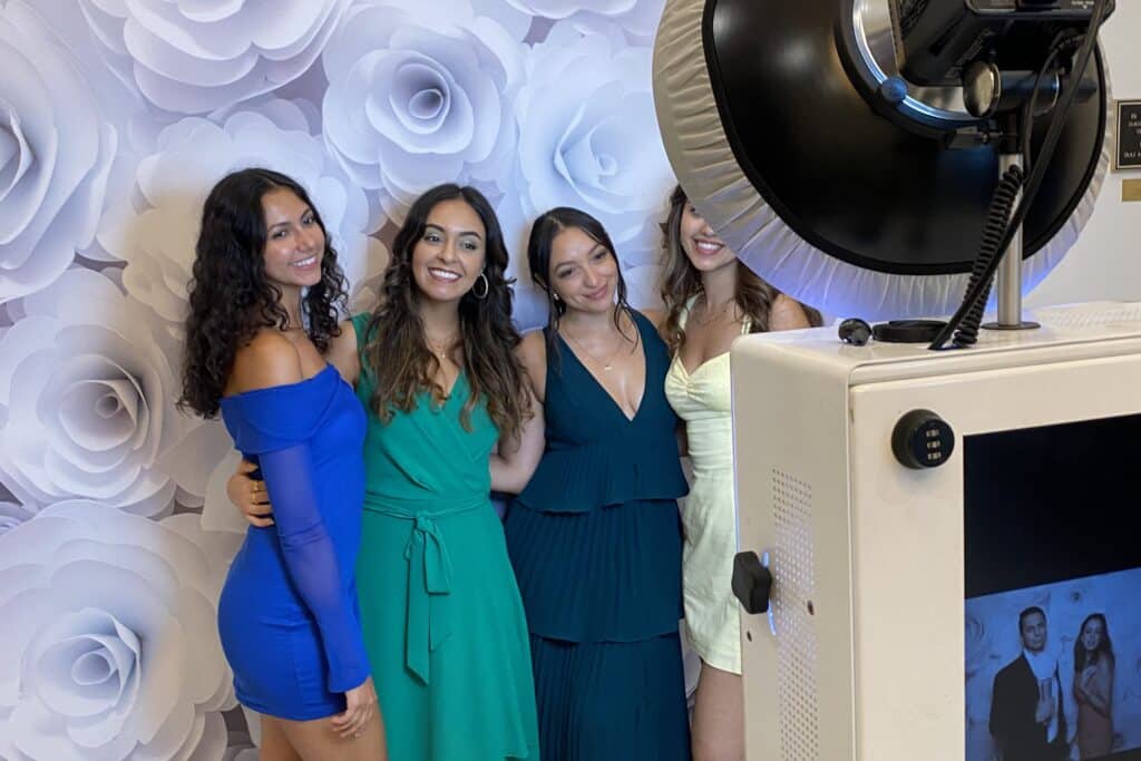 Group of girls taking a photo using props